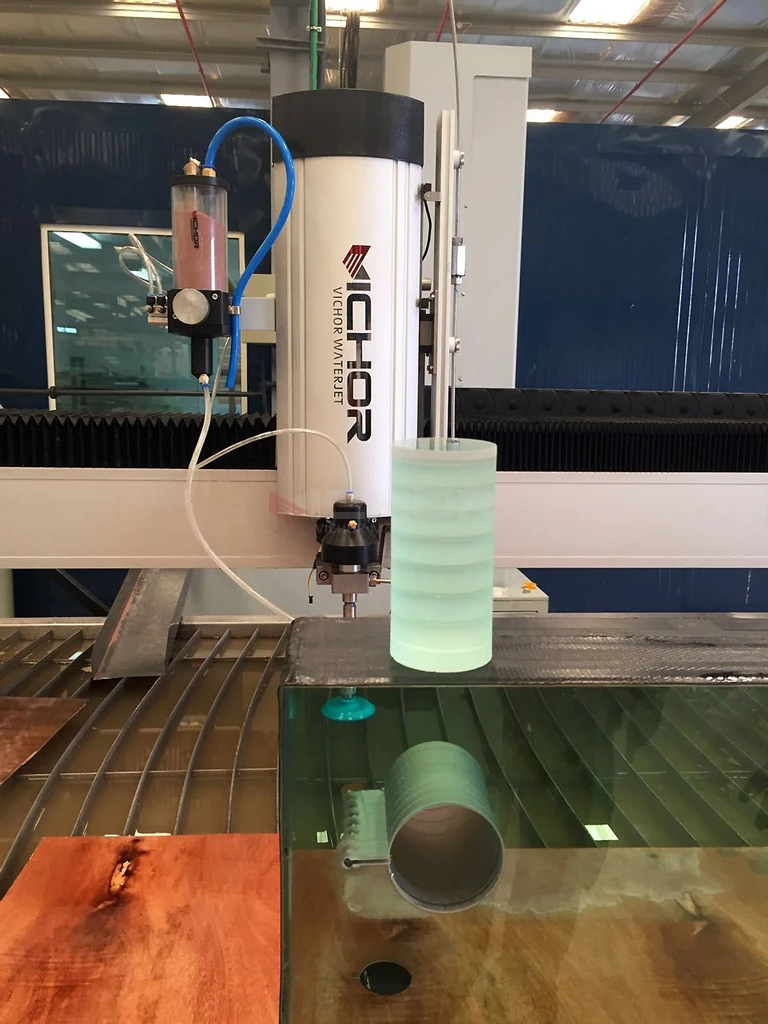 Cutting head above a cut glass cylinder