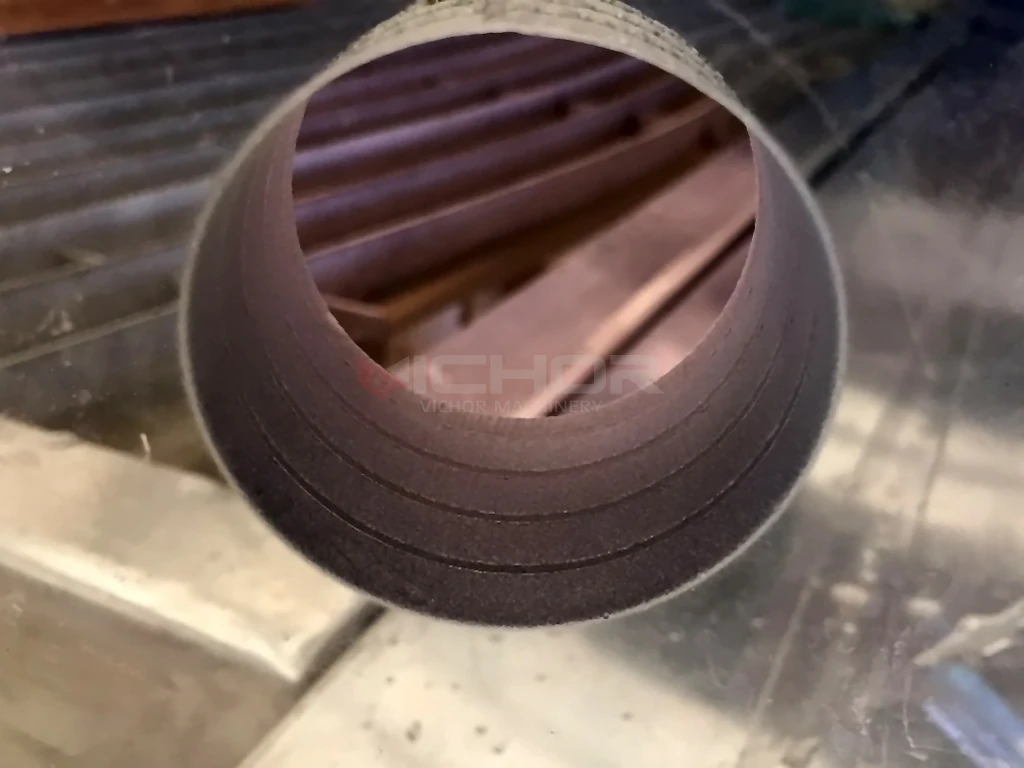 Waterjet-cut hole through a thick glass stack